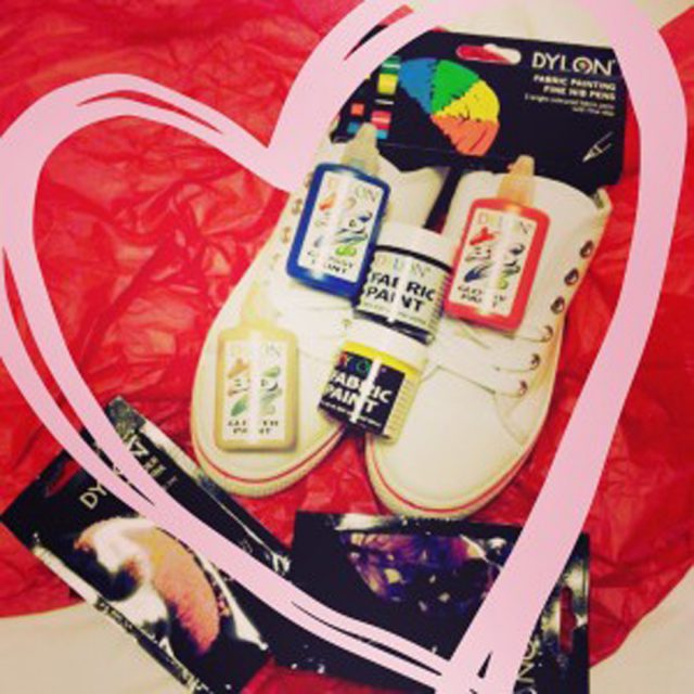 new white canvas shoes with paint supplies, markers and stickers