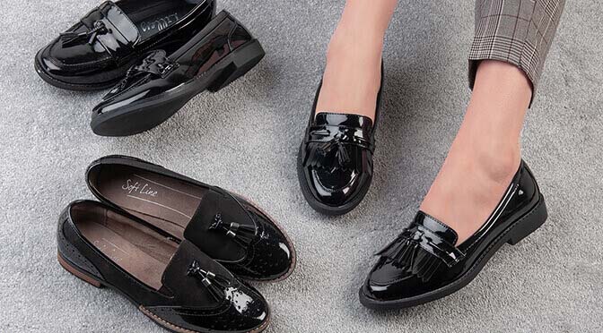 three pairs of black loafers with tassels