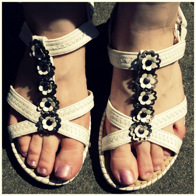  white sandals with flower detail 