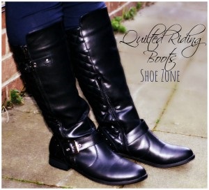 Tracy's black riding boots