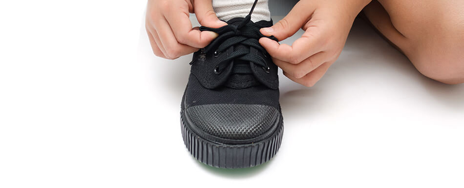 Child Tying Shoes