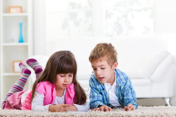 Kids lying on the carpet.